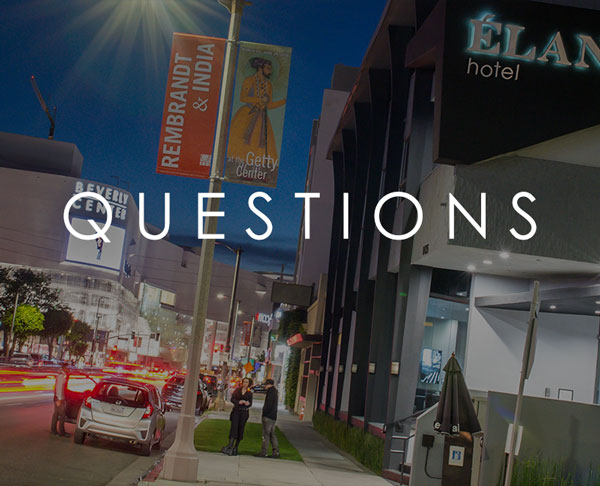 image of hotel exterior. Words on the image say "Questions"